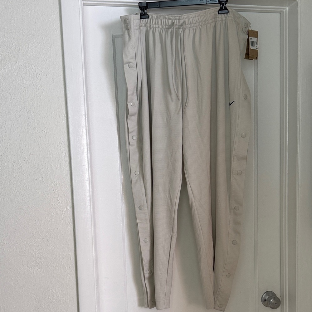 Women’s Nike Basketball Pants with snap closure on the legs